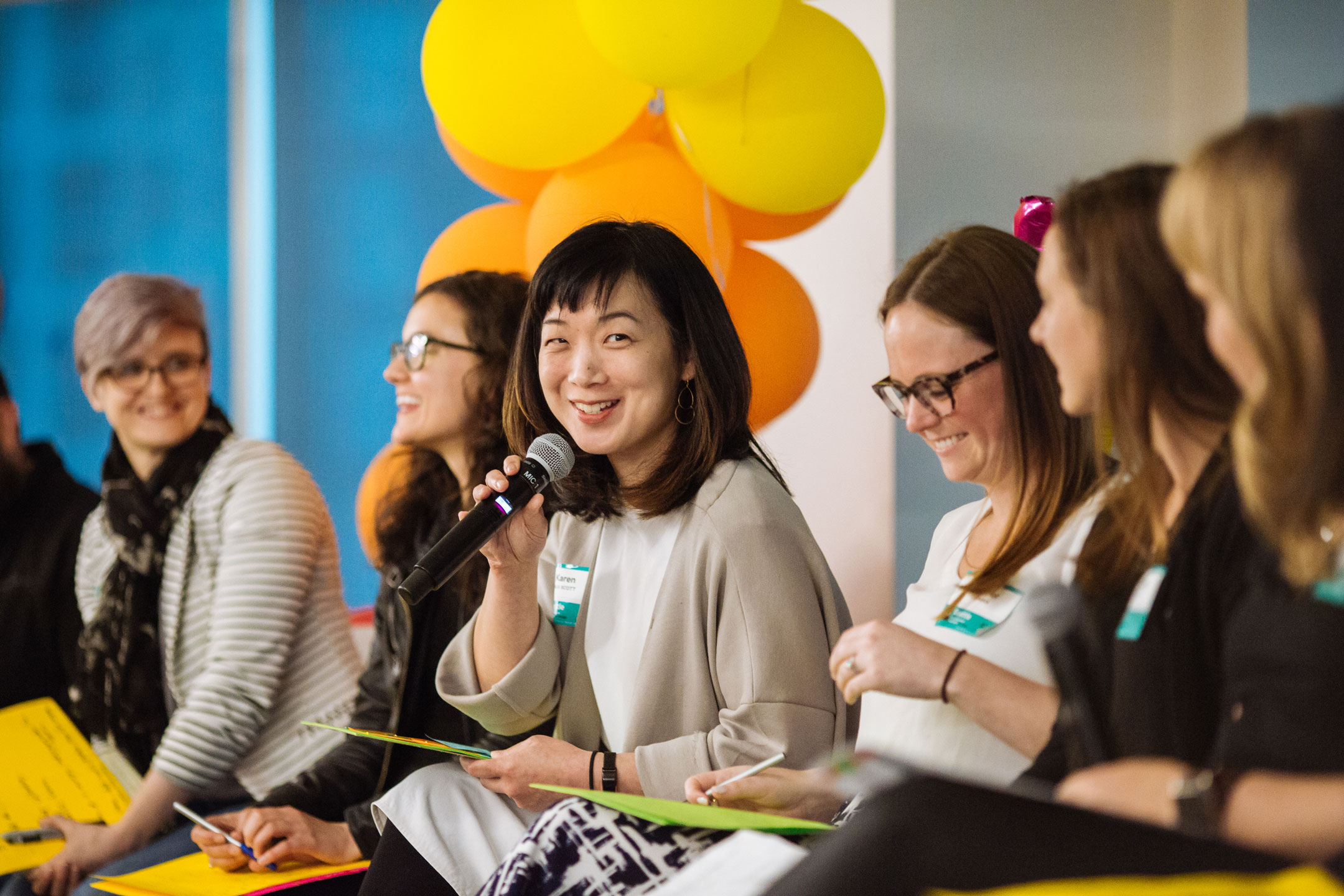 Panel speaker with microphone at 2018  Practicing Inclusion in the Creative Workplace event